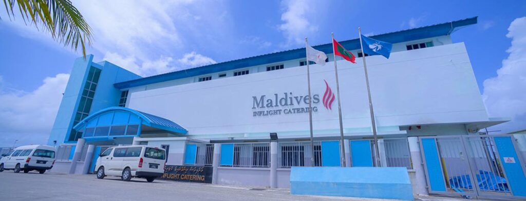Exterior view of the Maldives Inflight Catering building featuring brand identity and signage designed by Montpellier Creative.