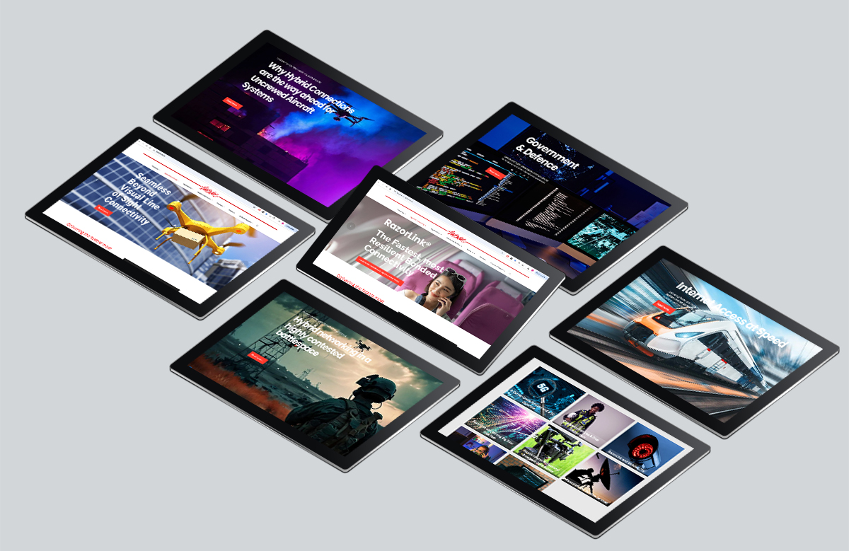 Website design for Livewire by Montpellier Creative displayed across multiple tablets, showcasing dynamic pages for sectors including UAV, government, defence, transport, and connectivity, all unified under the RazorLink® technology brand.