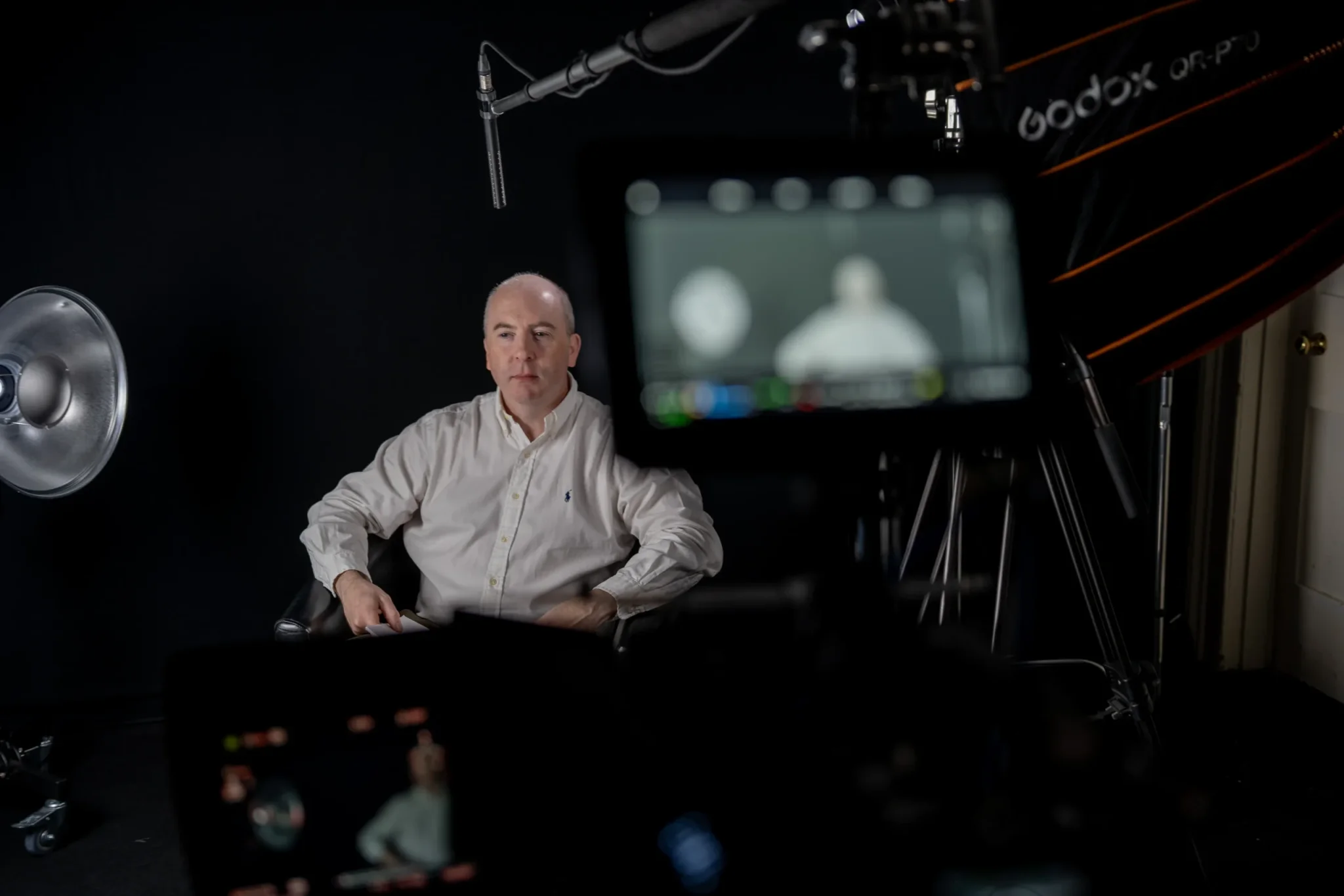 Man in video production studio being filmed for an explainer animation