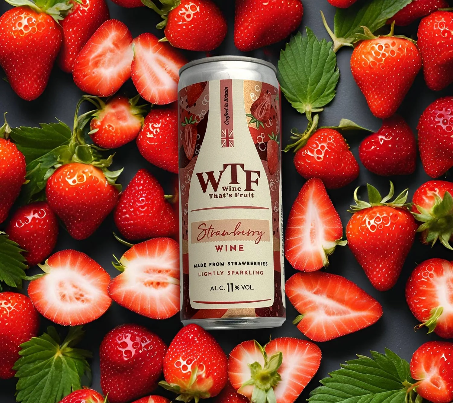 Product photo featuring a can of WTF Strawberry Wine surrounded by fresh strawberries – part of a commercial shoot showcasing the brand’s lightly sparkling fruit wine.